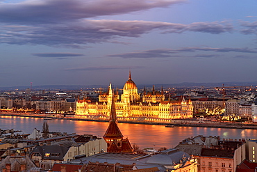 The Hungarian Parliament and the River Danube at night, UNESCO World Heritage Site, Budapest, Hungary, Europe