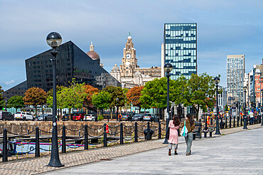 Tourists walking by the Albert Dock, Liverpool, Merseyside, England, United Kingdom, Europe