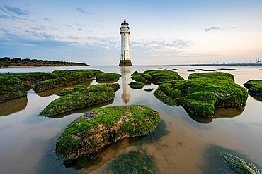 Perch Rock lighhouse at New Brighton with moss covered rocks, Wirral, Cheshire, England, United Kingdom, Europe