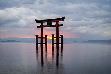 Tori gate reflected on Lake Biwa with dramatic sky, Shiga prefecture, Japan