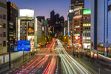 Traffic trails at night on busy road in Tokyo, Japan