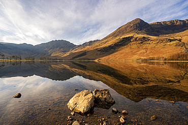 Lake Buttermere with mirror reflections at sunrise, Lake District National Park, Cumbria