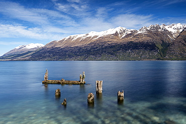 Decayed jetty, old wooden posts in Lake Wakatipu at Glenorchy, Otago Region, South Island, New Zealand, Pacific