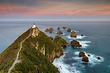 Nugget Point lighthouse at sunset, Kaka Point, Otago, South Island, New Zealand, Pacific