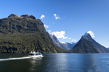 Sightseeing cruise ship at Milford Sound, Fiordland National Park, UNESCO World Heritage Site, South Island, New Zealand, Pacific