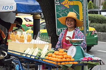 Female street vendor selling fruit and vegatables in Bangkok, Thailand, Southeast Asia, Asia