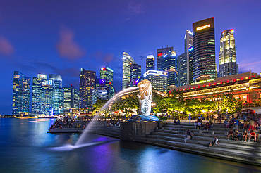 The Merlion at Marina Bay with The Fullerton Hotel set against The Financial District at night, Singapore, Southeast Asia, Asia