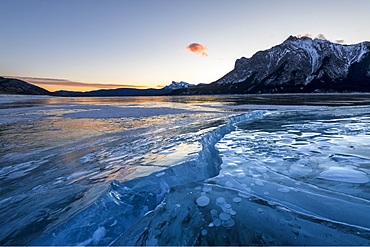 Ice formations with Mount Michener and Kista Peak in the background at sunrise, Abraham Lake, Kootenay Plains, Alberta, Canadian Rockies, Canada, North America