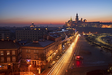 Wawel Castle at sunrise, UNESCO World Heritage Site, with traffic trails, Krakow, Poland, Europe