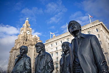 The bronze statue of the Beatles stands on Liverpool Waterfront, Liverpool, Merseyside, England, United Kingdom, Europe