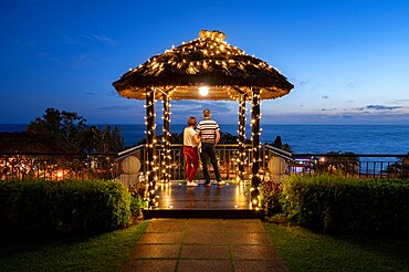 A couple stood looking at the evening sky, Funchal, Madeira, Portugal, Atlantic, Europe