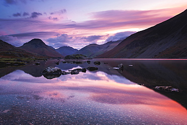 Pink clouds reflected in tranquil Wast Water, dawn, Wasdale, Lake District National Park, UNESCO World Heritage Site, Cumbria, England, United Kingdom, Europe