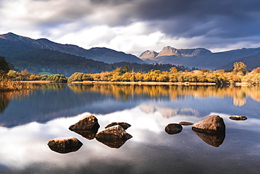 The Langdale Pikes reflected in the tranquil River Brathay, autumn, Elterwater, Lake District National Park, UNESCO World Heritage Site, Cumbria, England, United Kingdom, Europe