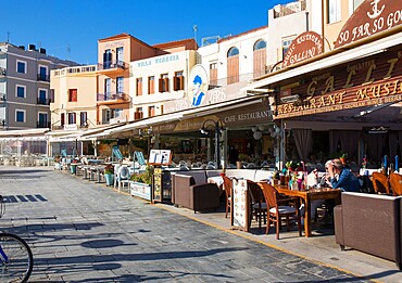 Colourful waterfront cafes and hotels beside the Venetian Harbour, Hania (Chania), Crete, Greek Islands, Greece, Europe