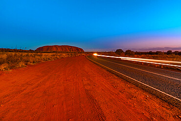 Car light trails along the road to Uluru (Ayers Rock) at night, Outback, Red Centre, Uluru-Kata Tjuta National Park, UNESCO World Heritage Site, Northern Territory, Australia, Pacific