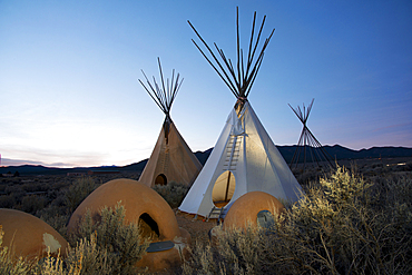 Teepees (tipis) on display at dusk in Taos, New Mexico, United States of America, North America