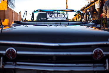 Detail of a vintage car with a New Mexico sign on it, in Old town, Albuquerque, New Mexico, United States of America, North America