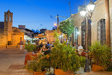 People eating at a restaurant outdoors at night in Latchi, Cyprus, Mediterranean, Europe