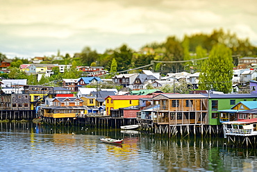 The colorful houses on the water, known as palafitos, in the town of Castro, Island of Chiloé, Chile