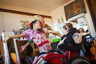 Two clowns from the Hopiclowns association, perform in a home for disabled adults in Geneva, Switzerland.