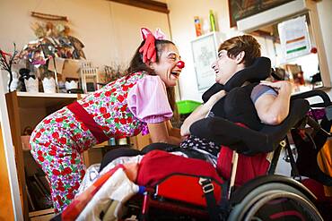 Two clowns from the Hopiclowns association, perform in a home for disabled adults in Geneva, Switzerland.