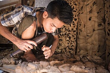 Wood carving, a carpenter works on a statue, Mandalay, Mandalay Region, Myanmar, Burma