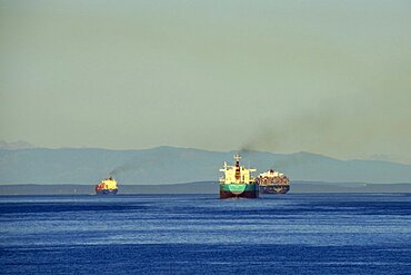 Victoria, British Columbia, Canada Three ships leaving port and heading out on the Strait of Juan de Fuca