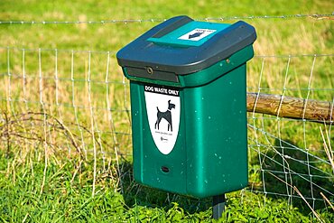 Green Dog Waste Bin at Wicken Fen, Cambridgeshire, East of England, England, UK