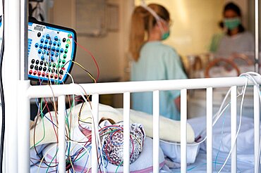 A nursery nurse takes care of a premature baby in the neonatalogy department. Hospital. Aix en Provence.