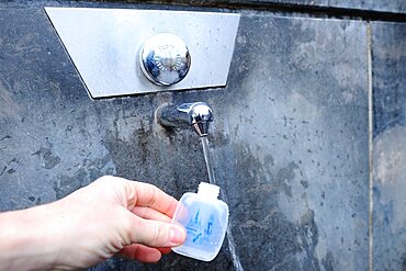 Consacrated water in the city of Lourdes.