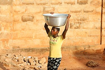 Woman carrying water.