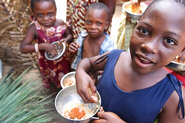 Children eating an african meal.