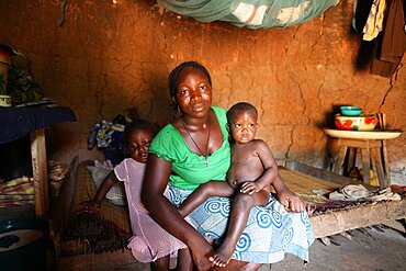 Woman and children in an african hut.