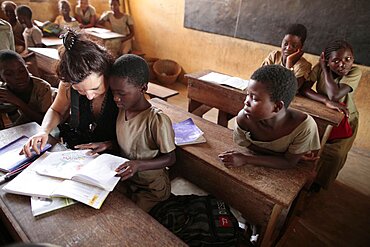 Sponsor and child in a primary school in Africa.