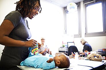 Reportage in a post-natal clinic in Champigny, France. Since leaving the neonatal unit, the twins (3-months old) are checked every week to follow their growth. Consultation with the post-natal clinic doctor.