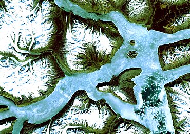 King Oscar Fjord, Greenland, True Colour Satellite Image. King Oscar Fjord located in Greenland National Park. The pastel blue indicates that the water has turned into ice. Image taken on 21 June 1991 using LANDSAT data.