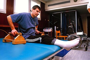 Paraplegic man in physiotherapy center