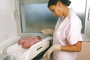 Weighing Newborn Baby