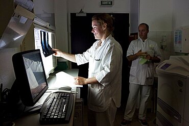 X-Ray Technician looking at Results