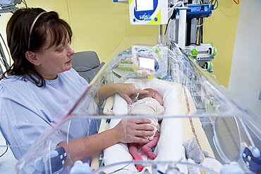 Mother And Premature Baby in Incubator