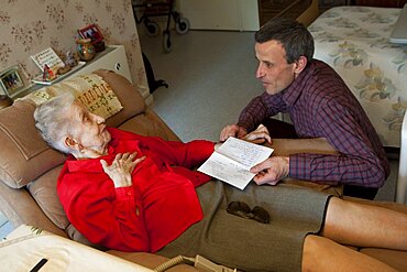 Doctor & Nurse Discuss Patient Charts