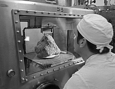 Lab technician examining a lunar sample