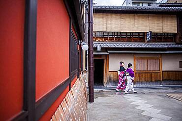 Girls dressed in kimono,in Pontocho, a traditional Japanese night-time entertainment area. Kyoto. Japan