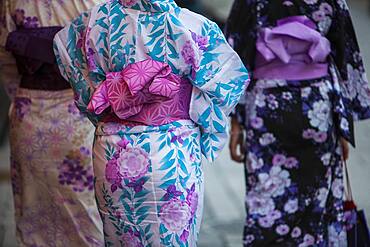 Women wearing kimono.Street scene in Hanamikoji dori street.Geisha's distric of Gion.Kyoto. Kansai, Japan.