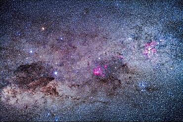 The amazing area of the southern Milky Way in Carina and Crux, the brightest part of the Milky Way after the galactic core region. At right is the Carina Nebula, with the Southern Pleiades cluster, IC 2602, below it. The Football Cluster, NGC 3532, is at upper left of the Carina Nebula. At centre is the region of Lambda Centauri, with the star cluster NGC 3766, the Pearl Cluster, above the emission nebulosity. At left is the Southern Cross, with the dark Coal Sack at bottom left of the Cross, with thin tendrils extending to the right. To the left of Alpha Cruxis at the bottom of the Cross is the star cluster NGC 4609; aboive Alpha is NGC 4649. To the left of Beta Cruxis at the left side of the Cross is the Jewel Box Cluster, NGC 4755.