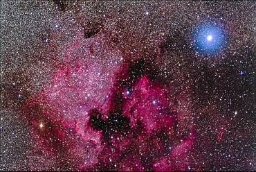 The North America Nebula (NGC 7000) and associated nebulosity and star clusters, near the bright blue-white star Deneb in Cygnus.