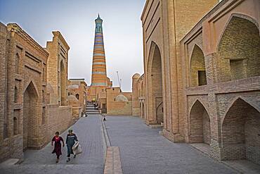 Islom Hoja Minaret. At right Sherghozi Khan Medressa. At left  Pahlavon Mahmud Mausoleum, Khiva, Uzbekistan