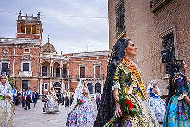 Flower offering parade,People with Floral tributes to `Virgen de los desamparados´, Fallas festival,Plaza Decimo Junio Bruto,Valencia