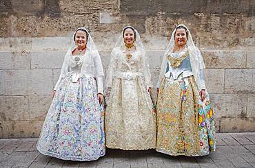 Women in Fallera Costumes during Flower offering parade, tribute to `Virgen de los desamparados��, Fallas festival, Plaza de la Virgen square,Valencia