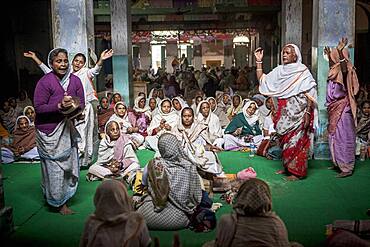 Widows praying in a Bhajan ashram, Vrindavan, Mathura district, India